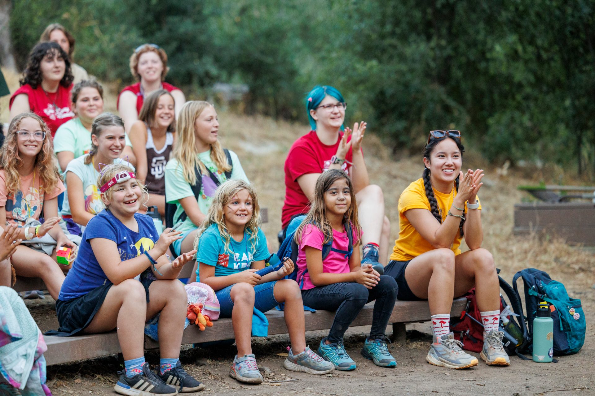 high school girl scout with tote bag outside at park or camp