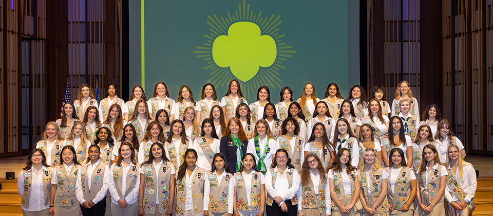  high school gold award girl scout with natural hair wearing ambassador vest 