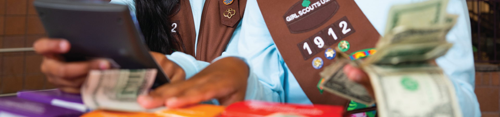  photo of calculator and girl scout cookie boxes 